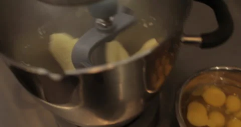 Raw chicken eggs are broken into a metal bowl on the table Stock Footage 256984475