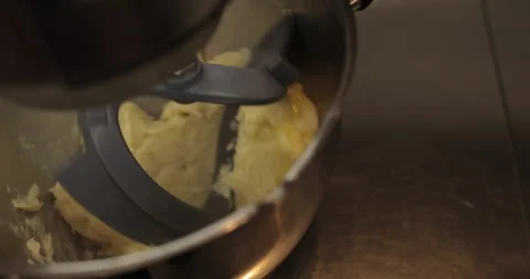 Raw chicken eggs are broken into a metal bowl on the table Stock Footage 256984803