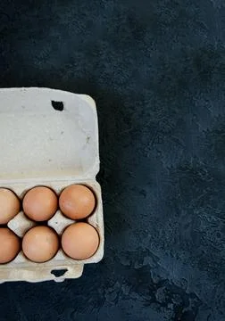 Raw chicken eggs in box Stock Photos