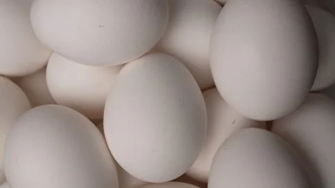 Raw chicken eggs rotating, top view Stock Footage 340812067