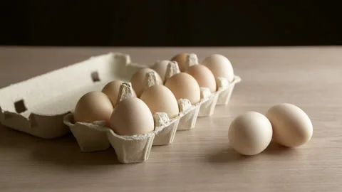 Raw chicken eggs in a tray. Close-up. Stock Footage 314269075