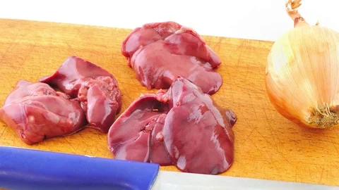 Raw chicken livers and onions Stock Footage