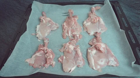 Raw chicken marinated with spices in a baking dish 動画素材 108223084