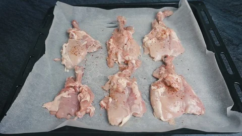 Raw chicken marinated with spices in a baking dish 스톡 동영상 108223199