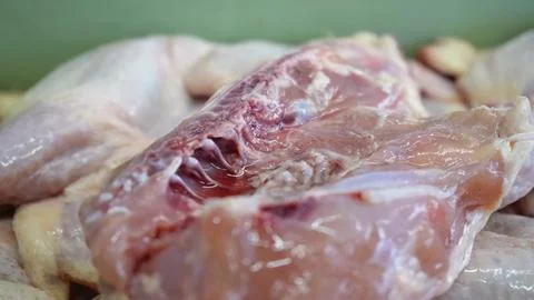 Raw chicken meat close up view inside a commercial food processing facility Fotos de archivo
