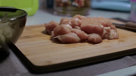 Raw chicken meat on a cutting board, cooking at home Stock Footage 128387582