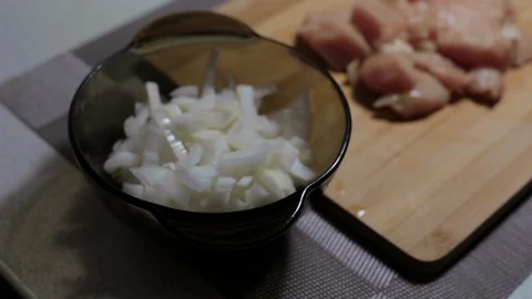Raw chicken meat on a cutting board, cooking at home Stock Footage 128387664