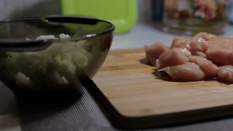 Raw chicken meat on a cutting board, cooking at home Stock Footage 128387848