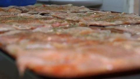 Raw chicken ready for marinade with lemon and pepper. Professional chef in  Stock Footage 90667019