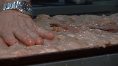 Raw chicken ready for marinade with lemon and pepper. Professional chef in  Stock Footage 90668723