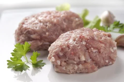Raw chicken rissole Stock Photos