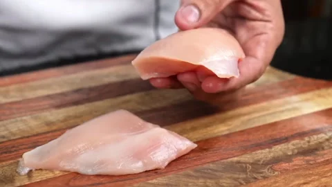 Raw chicken slice on cutting board in kitchen room Video stock 286849686
