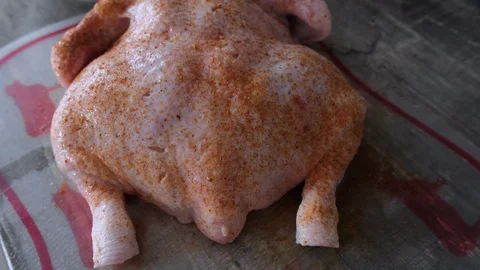 Raw chicken with spices for roasting in the oven. Top view, closeup Stock Footage 128667771