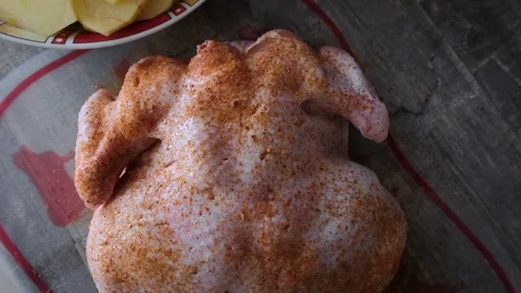 Raw chicken with spices for roasting in the oven. Top view, closeup Stock Footage 128667779