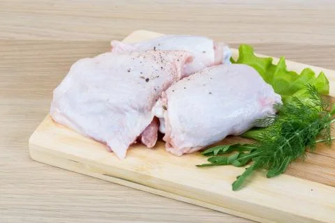 Raw chicken thighs Stock Photos