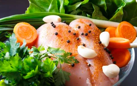 Raw chicken with vegetables Stock Photos