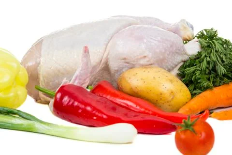 Raw chicken with vegetables Stock Photos