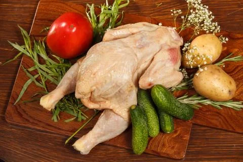 Raw chicken with vegetables Stock-Fotos