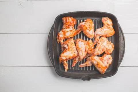 Raw chicken wings marinated Stock Photos