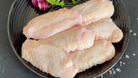Raw chicken wings poultry meat main course lunch or dinner tasty Stock Footage 333926050