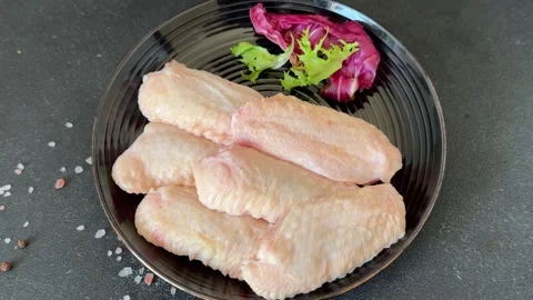 Raw chicken wings poultry meat main course lunch or dinner tasty Stock Footage 333926053