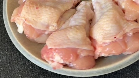 Raw chicken wings poultry meat main course lunch or dinner tasty Stock Footage 333926054