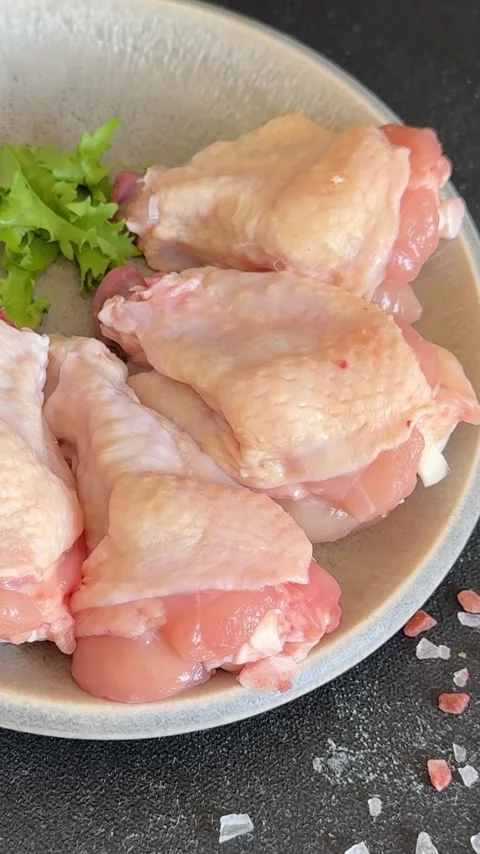 Raw chicken wings poultry meat main course lunch or dinner tasty Stock Footage 333926059
