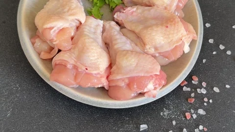 Raw chicken wings poultry meat main course lunch or dinner tasty Stock Footage 333926060