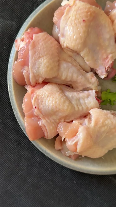 Raw chicken wings poultry meat main course lunch or dinner tasty Stock Footage 333926061