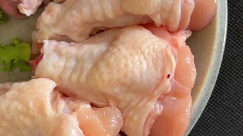 Raw chicken wings poultry meat main course lunch or dinner tasty Stock Footage 333926062