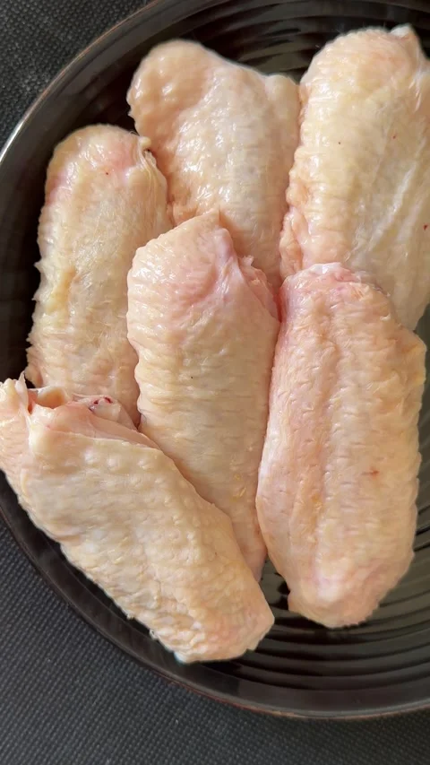 Raw chicken wings poultry meat main course lunch or dinner tasty Stock Footage 333926063