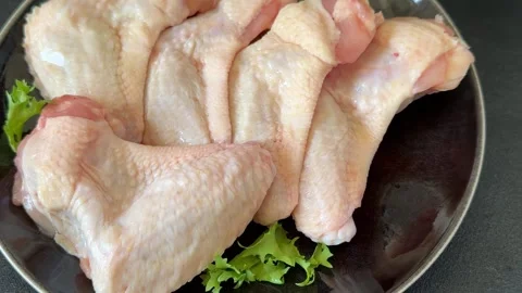 Raw chicken wings poultry meat main course lunch or dinner tasty Stock Footage 333926065