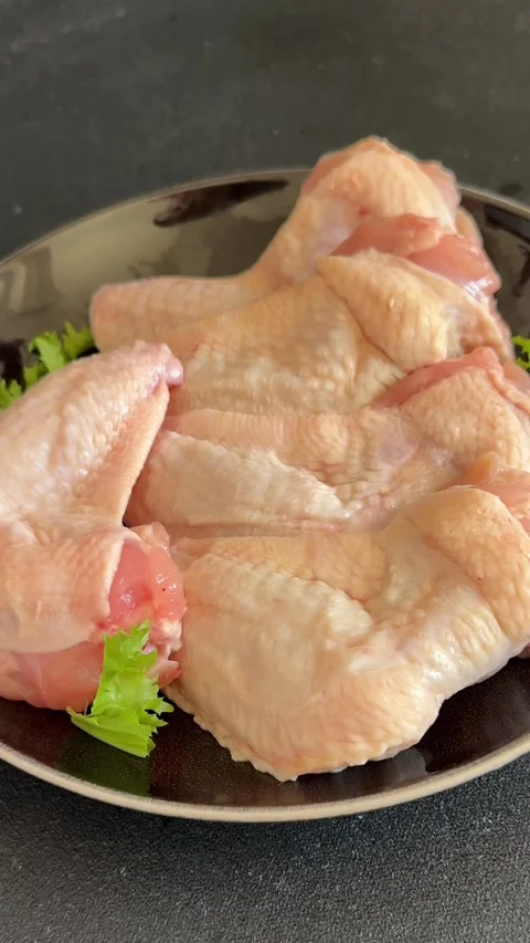 Raw chicken wings poultry meat main course lunch or dinner tasty Stock Footage 333926066