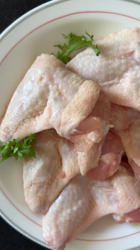 Raw chicken wings poultry meat main course lunch or dinner tasty Stock Footage 333926067