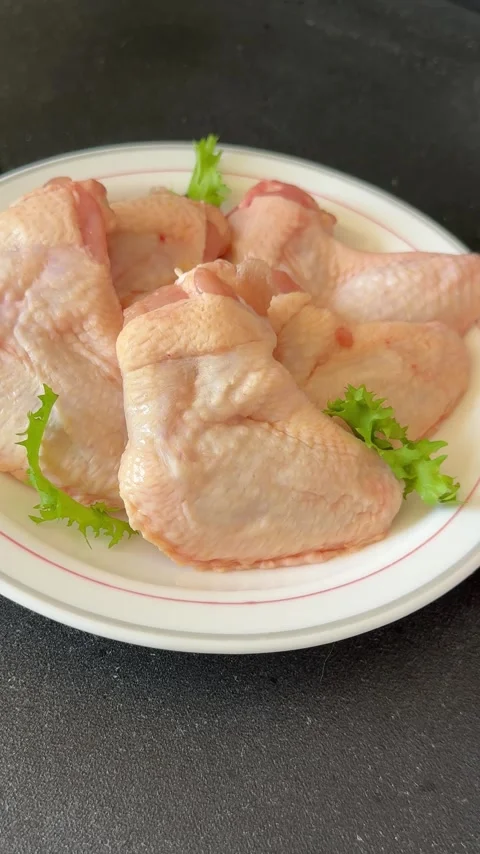 Raw chicken wings poultry meat main course lunch or dinner tasty Stock Footage 333926068
