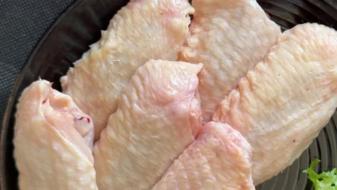 Raw chicken wings poultry meat lunch or dinner tasty snack fresh food Stock Footage 335651253
