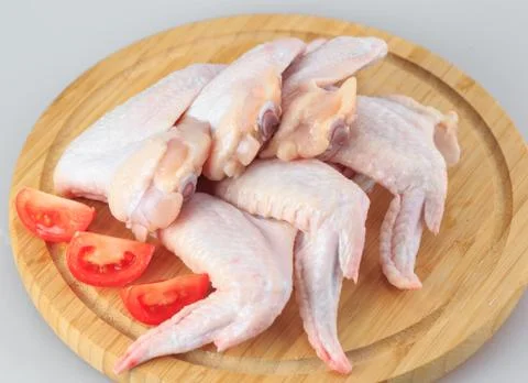 Raw chicken wings on a white background Stock Photos