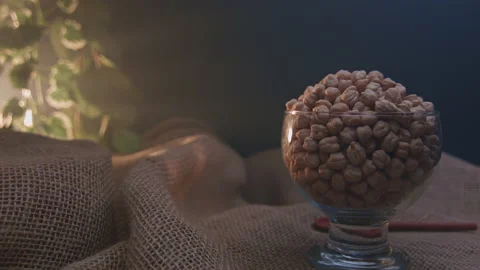 Raw chickpeas in a container Stockbeeldmateriaal 131446935