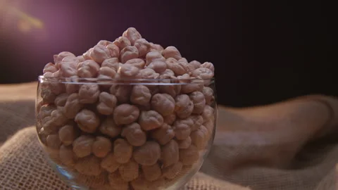 Raw chickpeas in a container Stockbeeldmateriaal 131457647