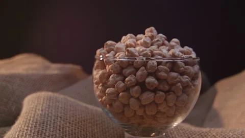 Raw chickpeas in a container Stockbeeldmateriaal 131464578