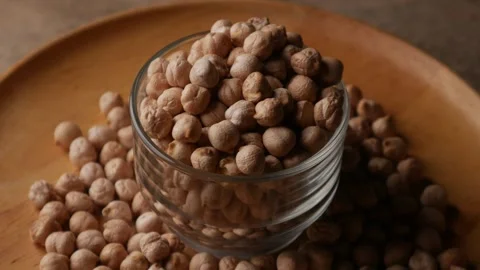 Raw Chickpeas on a rustic wooden table. Stock Footage 307856882
