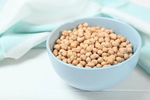 Raw chickpeas on the table. Stock Photos