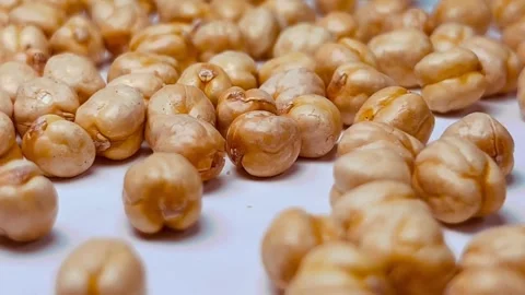 Raw chickpeas on white background, horizontal format, close up view Stock Footage 336471734