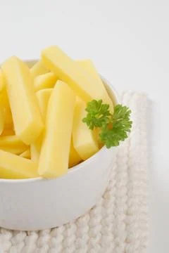 Raw chipped potatoes Stock Photos