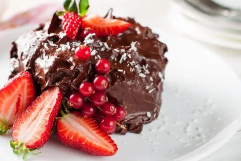 Raw chocolate and beetroot cake with berries Stock Photos