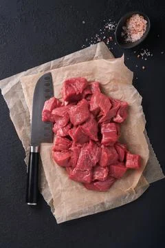 Raw chopped beef meat. Raw organic meat beef or lamb, spices, herbs on old pa Stock Photos