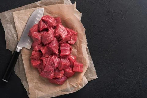 Raw chopped beef meat. Raw organic meat beef or lamb, spices, herbs on old pa Stock Photos