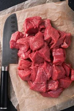Raw chopped beef meat. Raw organic meat beef or lamb, spices, herbs on old pa Stock Photos