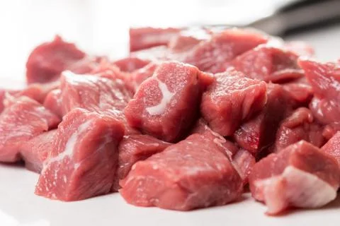 Raw chopped beef steak with chef knife in the background Stock-Fotos