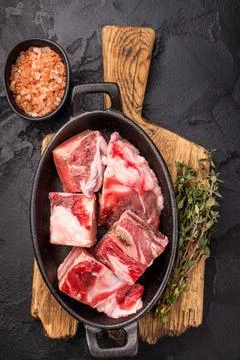 Raw chopped  lamb meat with bones, uncooked mutton ready for cooking. black.. Stock Photos